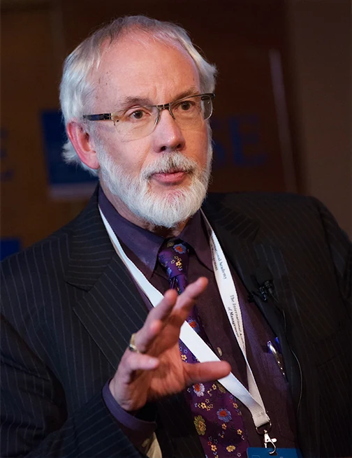 Portrait of Bob in a pinstripe suit and purple tie